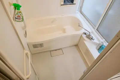 a small bathroom with a sink and a mirror at 100㎡ Cozy Villa in Shinjuku｜JR Shin-Ōkubo Sta. 7mins. in Tokyo