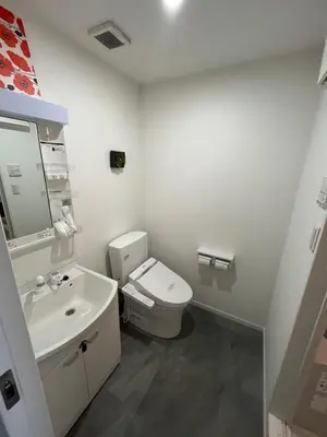 a bathroom with a white toilet and a sink at One Point Five in Tokyo