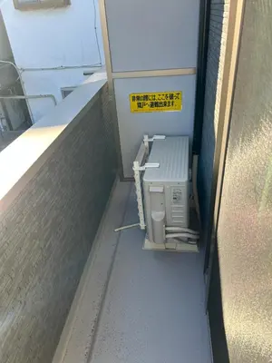 an outside view of a machine in a building at One Point Five in Tokyo