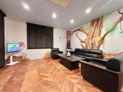 a living room with a large painting on the wall at S-asakusa -TT0418 in Tokyo