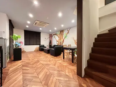 a living room with stairs and a dining room at S-asakusa -TT0418 in Tokyo