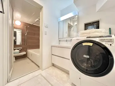 a washing machine in a bathroom with a shower at Shinjuku House-SJ0111 in Tokyo