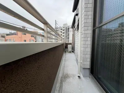 an empty corridor of a building with a window at Shinjuku House-SJ0111 in Tokyo