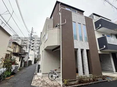 a bike is parked next to a house at Shinjuku House-SJ0111 in Tokyo