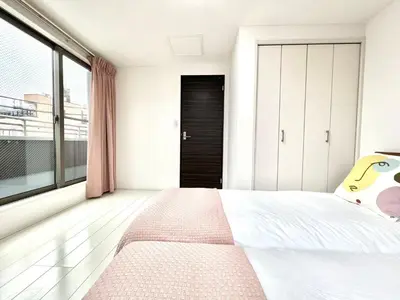 a bedroom with a bed and a large window at Shinjuku House-SJ0111 in Tokyo