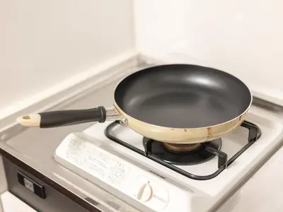 a pan sitting on top of a stove at Dryokan Kabukicho in Tokyo