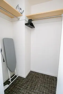 a closet with a chair in a room at Mr Kintaro Higashikomagata in Tokyo