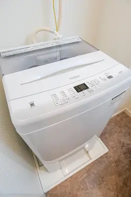 a washing machine is sitting on a wall at Mr Kintaro Higashikomagata in Tokyo