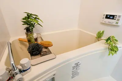a bathroom counter with plants on top of a sink at Mr Kintaro Higashikomagata in Tokyo
