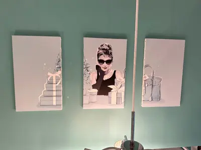 a wall with pictures of a woman with glasses and presents at Max4people Shinjuku 7minutes Shibuya12 minutes LEON RESORT SHIBUYA \u65b0\u5bbf\u6e0b\u8c37 \u6700\u5bc4\u308a\u521d\u53f0\u99c5 \u6700\u59274\u4eba in Tokyo