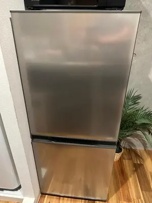 a stainless steel refrigerator in a kitchen at Style Lab\u5317\u5343\u4f4f in Tokyo