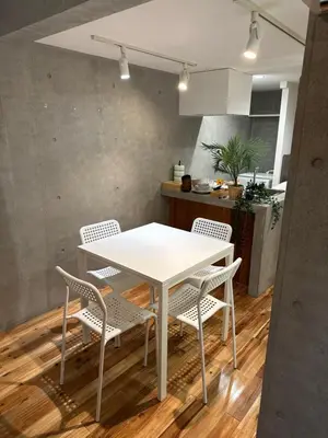 a white table and chairs in a kitchen at Style Lab\u5317\u5343\u4f4f in Tokyo