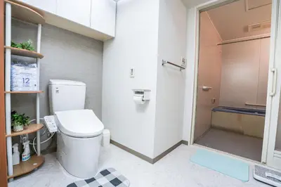a bathroom with a toilet and a walk in shower at Family-Friendly 2BR Apt in Tokyo 3 min to Yahiro St ation, Near Skytree in Tokyo