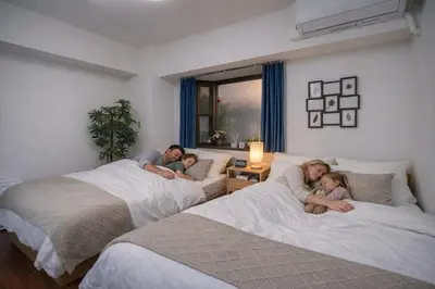 a group of people laying on beds in a room at Family-Friendly 2BR Apt in Tokyo 3 min to Yahiro St ation, Near Skytree in Tokyo