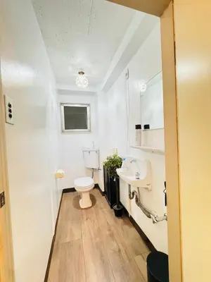 a bathroom with a toilet and a sink at Shinjuku vista point in Tokyo