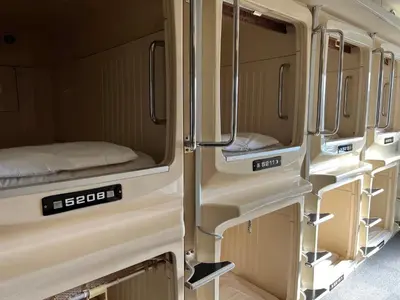 an interior view of an rv with its doors open at 男性専用サウナ&カプセル Men Only Capsule Room & Sauna, Bathhouse ミナミ下北沢 Minami Shimokitazawa in Tokyo