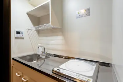 a small kitchen with a sink and a sinkiterator at OLD HERITAGE SHIBUYA in Tokyo