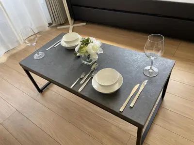 a table with plates and wine glasses on it at BISK PARK Higashi-Jujo in Tokyo