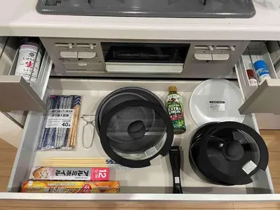an open refrigerator with a printer and some food at BISK PARK Higashi-Jujo in Tokyo