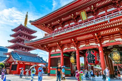 a large red building with people standing in front of it at BISK PARK Higashi-Jujo in Tokyo