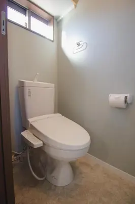 a white toilet in a bathroom with a window at QiQi Serenity Tokyo Exclusive New 3-Story Home, 14min to Skytree, Asakusa Area in Tokyo