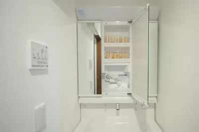 a white bathroom with a sink and a mirror at QiQi Serenity Tokyo Exclusive New 3-Story Home, 14min to Skytree, Asakusa Area in Tokyo