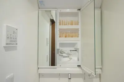 a bathroom with a sink and a mirror at QiQi Serenity Tokyo Exclusive New 3-Story Home, 14min to Skytree, Asakusa Area in Tokyo