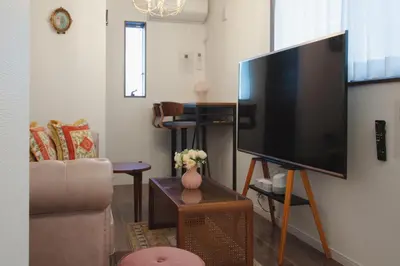 a living room with a large flat screen tv at QiQi Serenity Tokyo Exclusive New 3-Story Home, 14min to Skytree, Asakusa Area in Tokyo