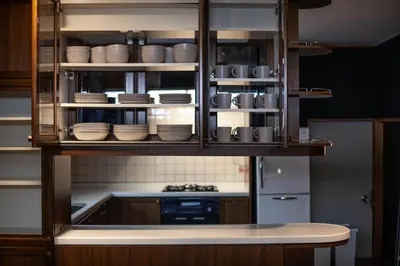 a kitchen with a cabinet full of plates and bowls at lucky aoto - Vacation STAY 16176 in Tokyo