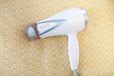 a white hair dryer sitting on top of a table at Lucky Higashi Mizue - Vacation STAY 16180 in Tokyo
