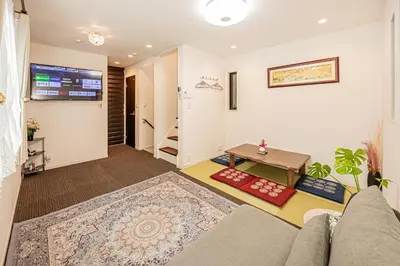 a living room with a couch and a table at Ikebukuro house with 3BR Shinjuku 5min in Tokyo