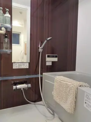 a bathroom with a bath tub with a shower at EMILIO158 - Quiet residential area near Shinjuku Free Wi-Fi in Tokyo