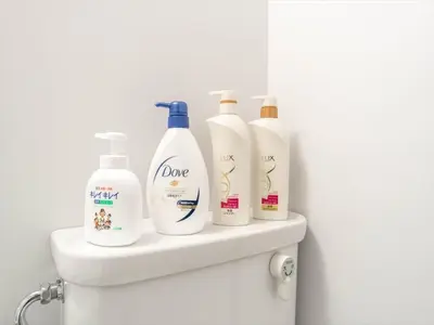 four bottles of detergent sitting on top of a toilet at Maison de Takinogawa - Vacation STAY 16164 in Tokyo