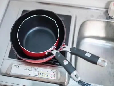 a frying pan sitting on top of a stove at Maison de Takinogawa - Vacation STAY 16164 in Tokyo