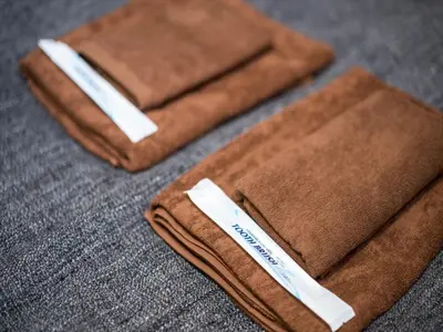two brown towels sitting on top of a table at Maison de Takinogawa - Vacation STAY 16164 in Tokyo