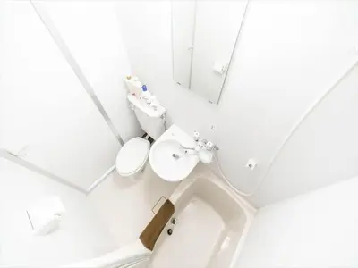 a white bathroom with a sink and a mirror at Maison de Takinogawa - Vacation STAY 16163 in Tokyo