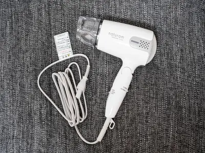 a white hair dryer sitting on top of a table at Maison de Takinogawa - Vacation STAY 16163 in Tokyo