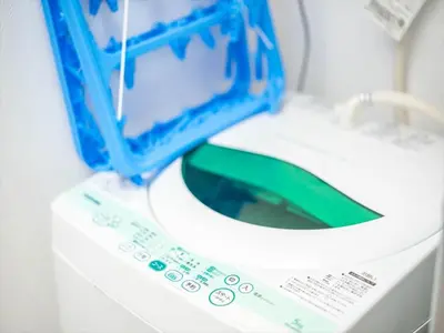 a toilet with a blue box on top of it at Maison de Takinogawa - Vacation STAY 16165 in Tokyo