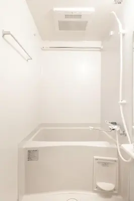 a white bathroom with a sink and a toilet at Float Inn Asakusa in Tokyo