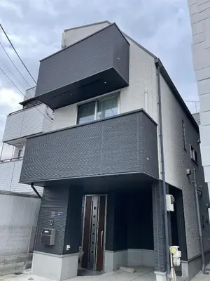 a black building with a door on the side of it at Bisk Park Higashijujo - Vacation STAY 83637v in Tokyo