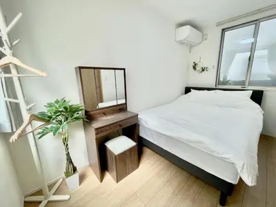 a small bedroom with a bed and a window at Bisk Park Higashijujo - Vacation STAY 83637v in Tokyo