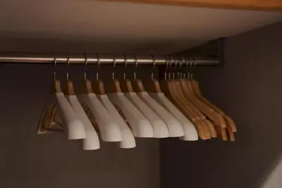 a group of wooden baseballoons hanging on a rack at Penthouse 1-bedroom flat in Hiroo Shibuya in Tokyo