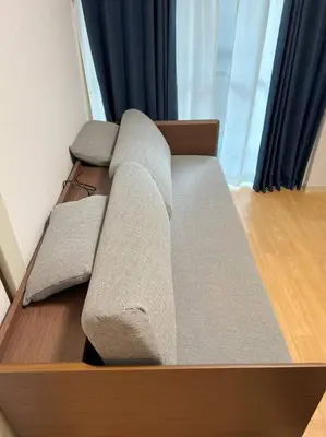 a bed with two pillows on top of it at G&R House 202　Shinjuku room in Tokyo