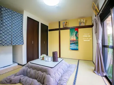 a living room with a table and a couch at 7\u6642IN19\u6642OUT # \u6c60\u888b\u738b\u5b50\u8d64\u7fbd\u99c5\u7121\u6599\u9001\u8fce # \u30c6\u30e9\u30b9\u30cf\u30a6\u30b9 # \u99c5\u8fd110\u5206 # \u4e0a\u91ce\u99c5\u96fb\u8eca12\u5206 # \u6700\u59277\u540d # 7 00 IN19 00 OUT # Free pick-up at Ikebukuro, Oji, and Akabane Stations # Terrace House # 10 min to station # 12 min to Ueno # Max 7 in Tokyo