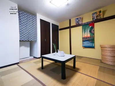 a room with a table in the middle of a room at 7\u6642IN19\u6642OUT # \u6c60\u888b\u738b\u5b50\u8d64\u7fbd\u99c5\u7121\u6599\u9001\u8fce # \u30c6\u30e9\u30b9\u30cf\u30a6\u30b9 # \u99c5\u8fd110\u5206 # \u4e0a\u91ce\u99c5\u96fb\u8eca12\u5206 # \u6700\u59277\u540d # 7 00 IN19 00 OUT # Free pick-up at Ikebukuro, Oji, and Akabane Stations # Terrace House # 10 min to station # 12 min to Ueno # Max 7 in Tokyo