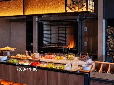 a buffet line with many different types of food at Mitsui Garden Hotel Ginza Tsukiji in Tokyo