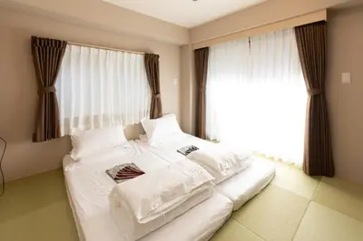 a large white bed in a room with a window at Light Hotel - Vacation STAY 91012v in Tokyo