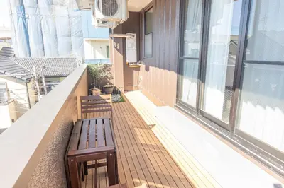 a bench on the balcony of a building at Light Hotel - Vacation STAY 91012v in Tokyo