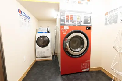 a washing machine and a washer and dryer in a room at Light Hotel - Vacation STAY 91078v in Tokyo