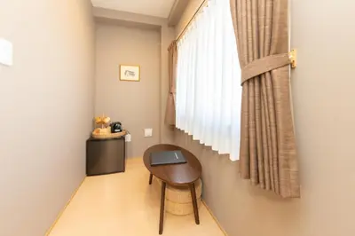 a small table in a room with a window at Light Hotel - Vacation STAY 91078v in Tokyo